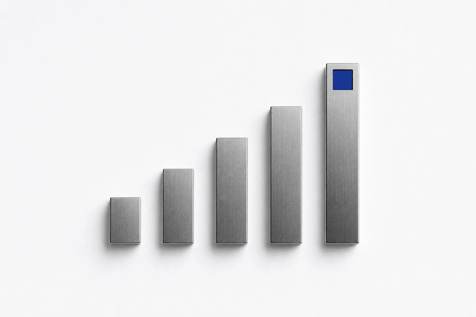 Five polished steel blocks in a row, each taller than the last, the tallest carrying an indigo inset.